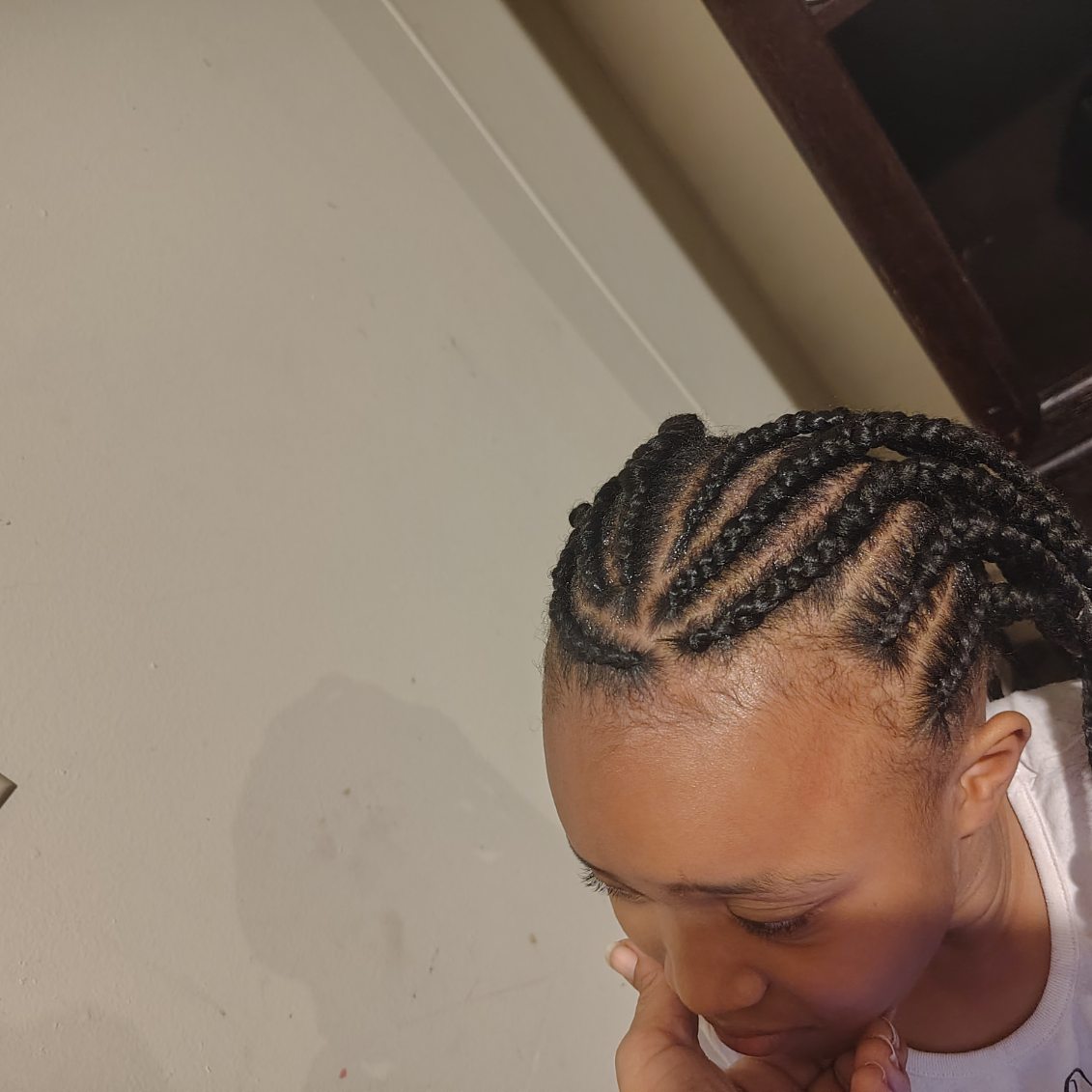 Neat cornrows seen from above, styled by Jazmiane
